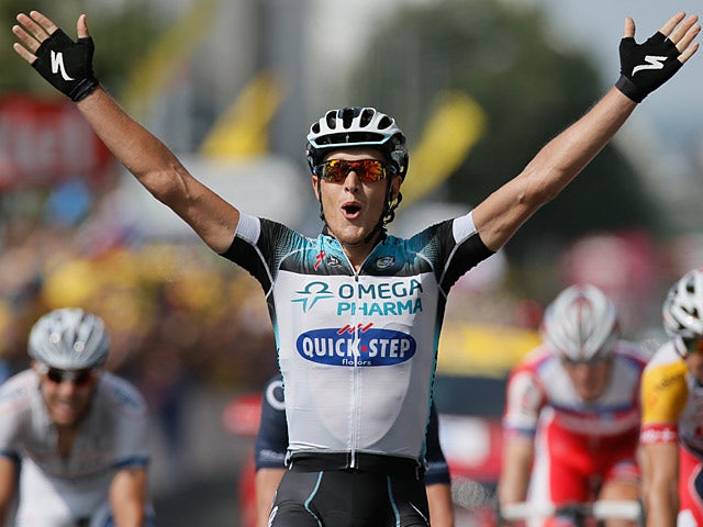 Matteo Trentin celebrates as he crosses the line of the fourteenth stage of the Tour de France on July 13, 2013