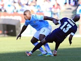 Manchester City's Micah Richards and SuperSport's Innocent Mdledle battle for the ball during their Nelson Mandela Football Invitational match on July 14, 2013