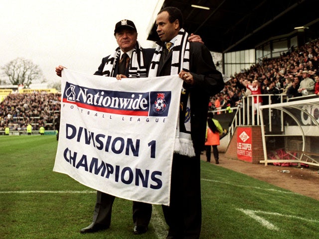 Fulham's Owner Mohamed Al Fayed celebrates with manager Jean Tigana as they are named Division 1 Champions on April 16, 2001