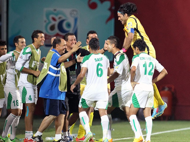 The Iraq team celebrates the opening goal against Uruguay during their Under-20 World Cup semi final match on July 10, 2013