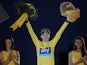 Chris Froome celebrates on the podium after winning the Tour de France on July 21, 2013