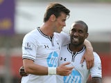 Tottenham's Gareth Bale celebrates with team mate Jermaine Defoe after scoring the opening goal against Swindon in a pre-season friendly on July 16, 2013