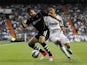 Granada's Guilherme Siqueira is pursued by Real Madrid's Angel Di Maria during the La Liga match on September 2, 2012