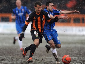 Barnet's Kyle De Silva and Cheltenham's Sam Deering battle for the ball during the League Two match on March 23, 2013