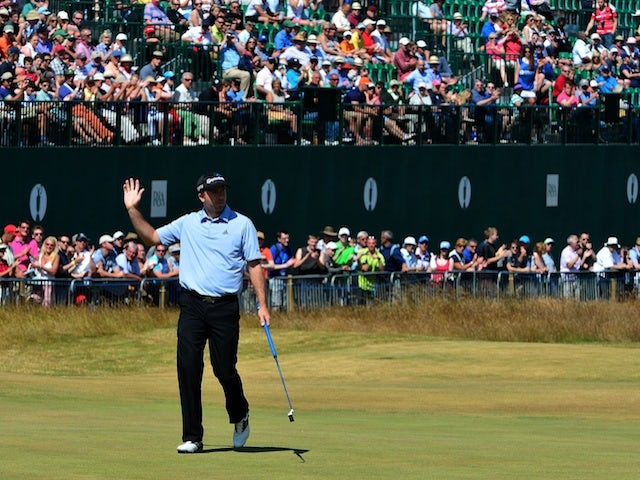 Martin Laird waves to the crowd at The Open on July 19, 2013