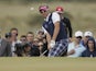 Ian Poulter of England chips onto the 16th green during the final round of the British Open Golf Championship on July 21, 2013