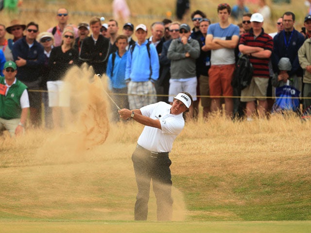USA's Phil Mickelson plays out of the bunker on the 10th hole during day four of the 2013 Open Championship on July 21, 2013