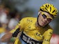 Chrisr Froome of Britain flashes a thumbs up and a big smile as he crosses the finish of the 20th stage of the Tour de France on July 20, 2013