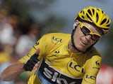 Chrisr Froome of Britain flashes a thumbs up and a big smile as he crosses the finish of the 20th stage of the Tour de France on July 20, 2013