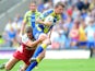 Warrington Wolves' Lee Briers is tackled by Hull Kingston Rovers' Richard Beaumont during the Super League match on July 21, 2013