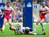 Warrington Wolves' Chris Riley goes over for a try against Hull Kingston Rovers during the Super League match on July 21, 2013