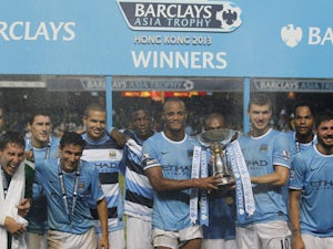 Manchester City players celebrate winning the Asia Cup on July 27, 2013