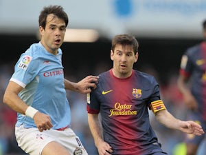 Celta's Borja Oubina in action against Barcelona on March 30, 2013