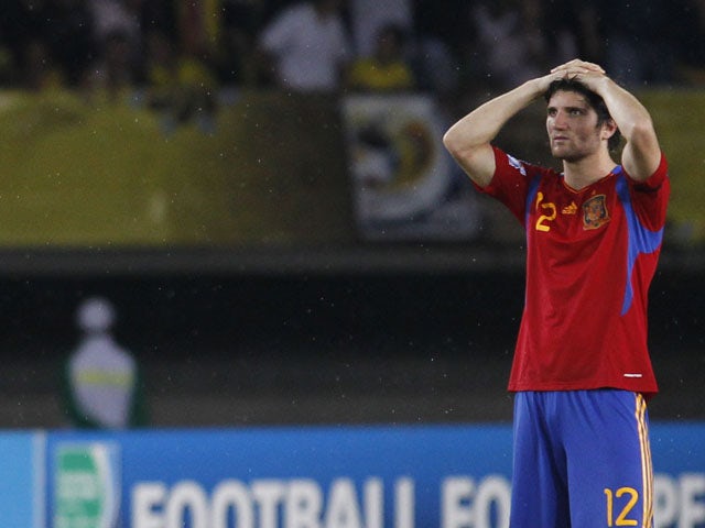 Spain's Carles Planas holds his head after losing against Brazil in a penalty shootout during the U-20 World Cup on August 14, 2011