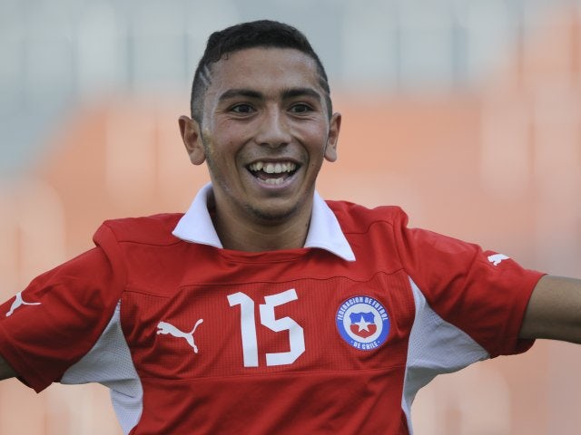 Cristian Cuevas celebrates scoring a goal for Chile.
