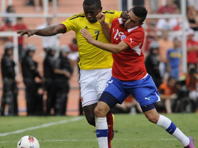 Cristian Cuevas tussles for possession against Colombia.