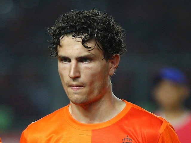 Holland's Daryl Janmaat lines up for a game with Indonesia on June 7, 2013