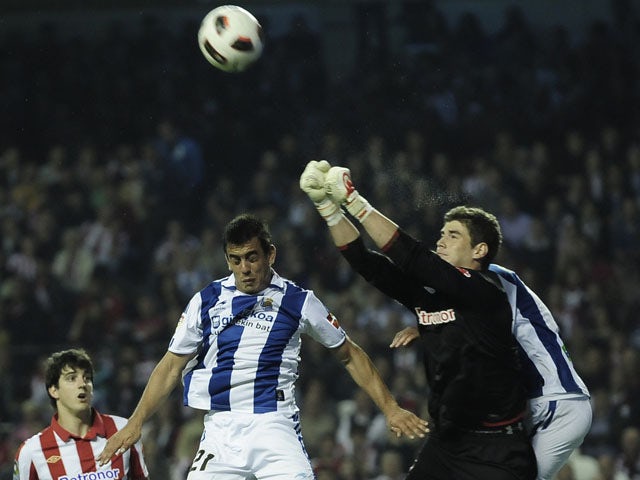 Real Sociedad's Diego Ifran jumps for the ball during the match against Athletic Bilbao on April 23, 2011