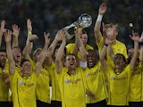 Dortmund's Sebastian Kehl raises the trophy after winning the German Super cup on July 26, 2013