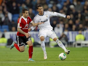 Celta de Vigo's Hugo Mallo tries to tackle Real Madrid's Cristiano Ronaldo during the La Liga clash on January 9, 2013