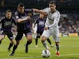 Valladolid's Jesus Rueda vies for the ball with Real Madrid's Cristiano Ronaldo during the La Liga match on May 4, 2013 