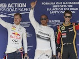 Lewis Hamilton, Sebastian Vettel and Romain Grosjean wave following qualifying for the Hungarian GP on July 27, 2013