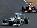Lewis Hamilton steers his car ahead of Sebastian Vettel during the Hungarian Grand Prix on July 28, 2013