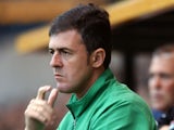 Racing Santander coach Lucas Alcaraz watches his team from the sideline on July 27, 2004