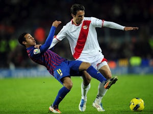 Rayo Vallecano's Rafa Garcia duels for the ball with  FC Barcelona's Thiago Alcantara during the La Liga match on November 29, 2011