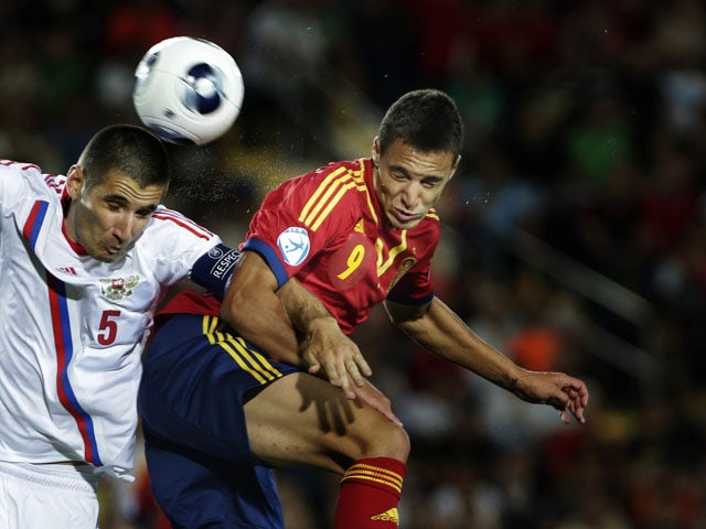 Spain's Rodri Moreno duels for the ball with Russia's Taras Burlak during UEFA European U21 Soccer match on June 6, 2013