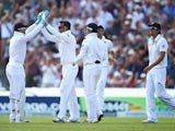 Graeme Swann of England celebrates the wicket of Chris Rogers of Australia with team mates during day one of the 3rd Ashes test on August 1, 2013