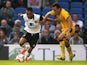 Brighton & Hove Albion's David Lopez battles for possession of the ball with Norwich City's Nathan Redmond during the pre-season friendly on July 30, 2013