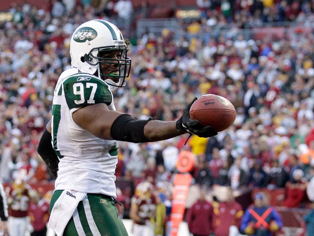 Calvin Pace of the New York Jets celebrates after recovering a fumble against the Washington Redskins on December 4, 2011