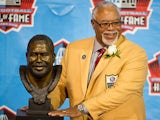 Former Kansas City Chiefs and Houston Oilers defender Curley Culp poses with his bust during the NFL Class of 2013 Enshrinement Ceremony on August 3, 2013
