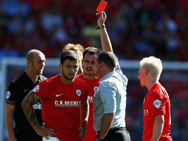 Barnsley's Dale Jennings is shown a red card during the second half against Wigan on August 3, 2013