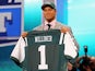 New York Jets' Dee Milliner holds up his jersey on April 25, 2013