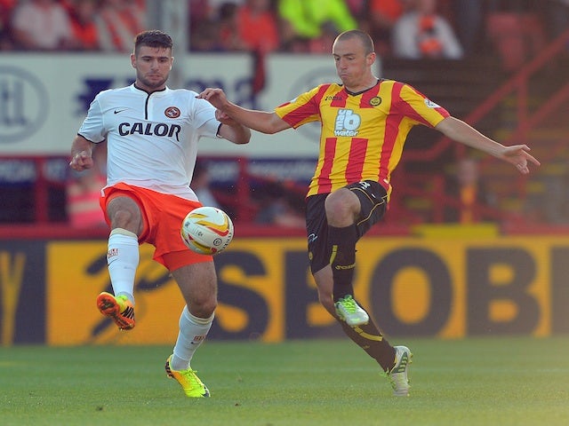Players from Dundee United and Partick Thistle in action during their SPL game on August 2, 2013