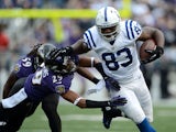 Dwayne Allen of the Indianapolis Colts runs for yards after the catch against Cary Williams of the Baltimore Ravens on January 6, 2013