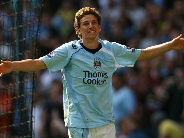 Elano of Manchester City celebrates scoring his team's third goal during the Barclays Premier League match between Manchester City and West Bromwich Albion at the City of Manchester Stadium on April 19, 2009