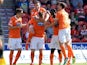 Blackpool's Gary Mackenzie is congratulated by team mates after scoring against Doncaster on August 3, 2013
