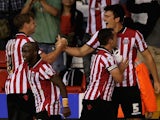Sheffield United's Harry McGuire celebrates with teammates after a goal against Notts County on August 2, 2013