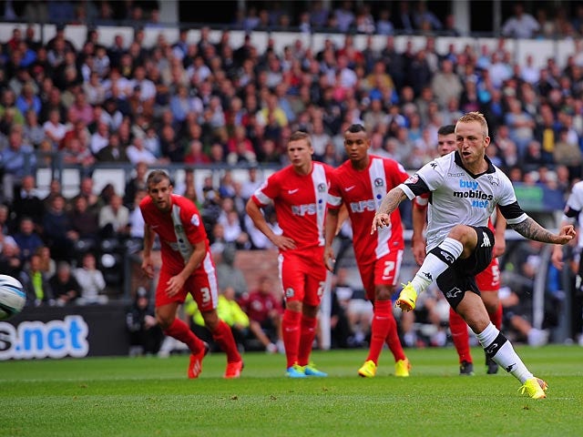 Derby's Johnny Russell scores the opener from the penalty spot during the match against Blackburn on August 4, 2013
