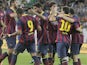 FC Barcelona's players celebrate scoring against Lechia Gdansk during their friendly match on July 30, 2013