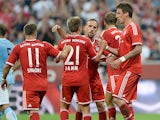 Bayern's Mario Mandzukic is congratulated by team mates after scoring the second goal against Manchester City on August 1, 2013
