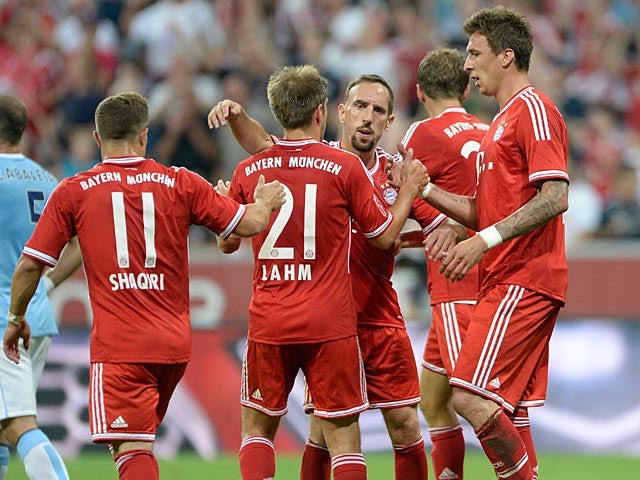 Bayern's Mario Mandzukic is congratulated by team mates after scoring the second goal against Manchester City on August 1, 2013