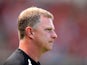Huddersfield manager Mark Robins watches his team during the match against Nottingham Forest on August 3, 2013