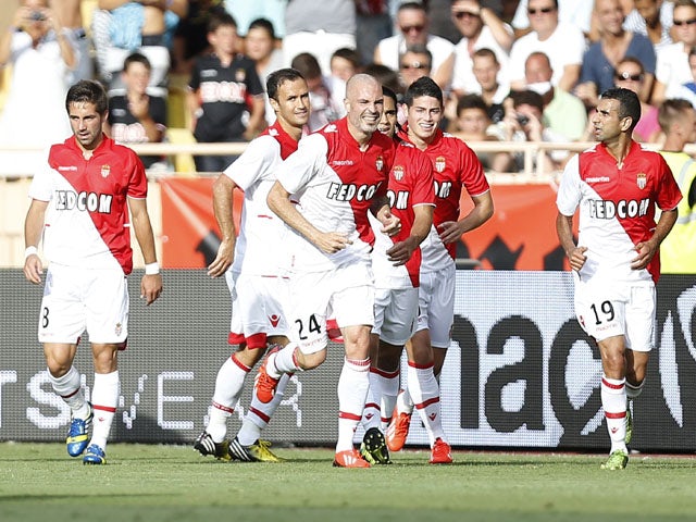 Monaco's Italian defender Andrea Raggi celebrates after scoring a goal during their friendly football match versus Tottenham on August 3, 2013