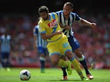 Porto's Nabil Ghilas and Napoli's Alessandro Gamberini battle for the ball during a friendly match on August 4, 2013