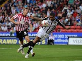 Notts County and Sheffield United players vie for the ball during their match on August 2, 2013