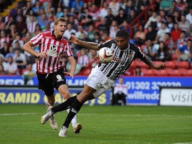 Notts County and Sheffield United players vie for the ball during their match on August 2, 2013